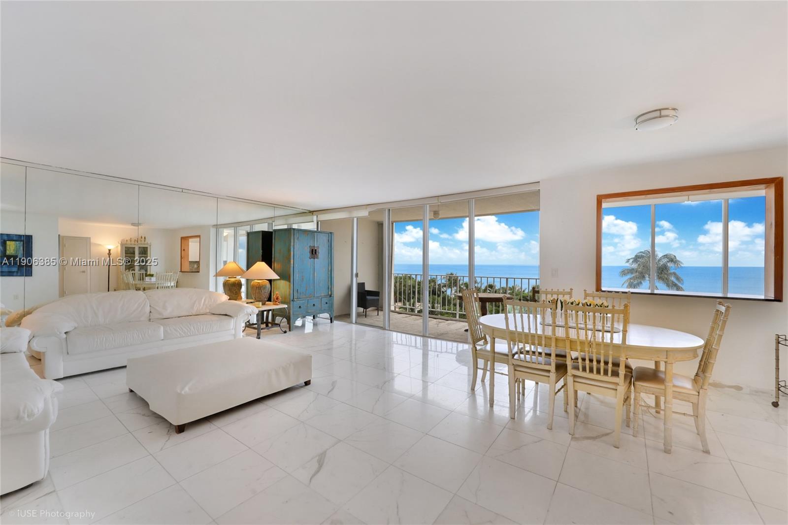 881 Ocean Drive, Unit 5D Key Biscayne, FL 33149 - Photo 4 of 18 a living room with furniture and a table