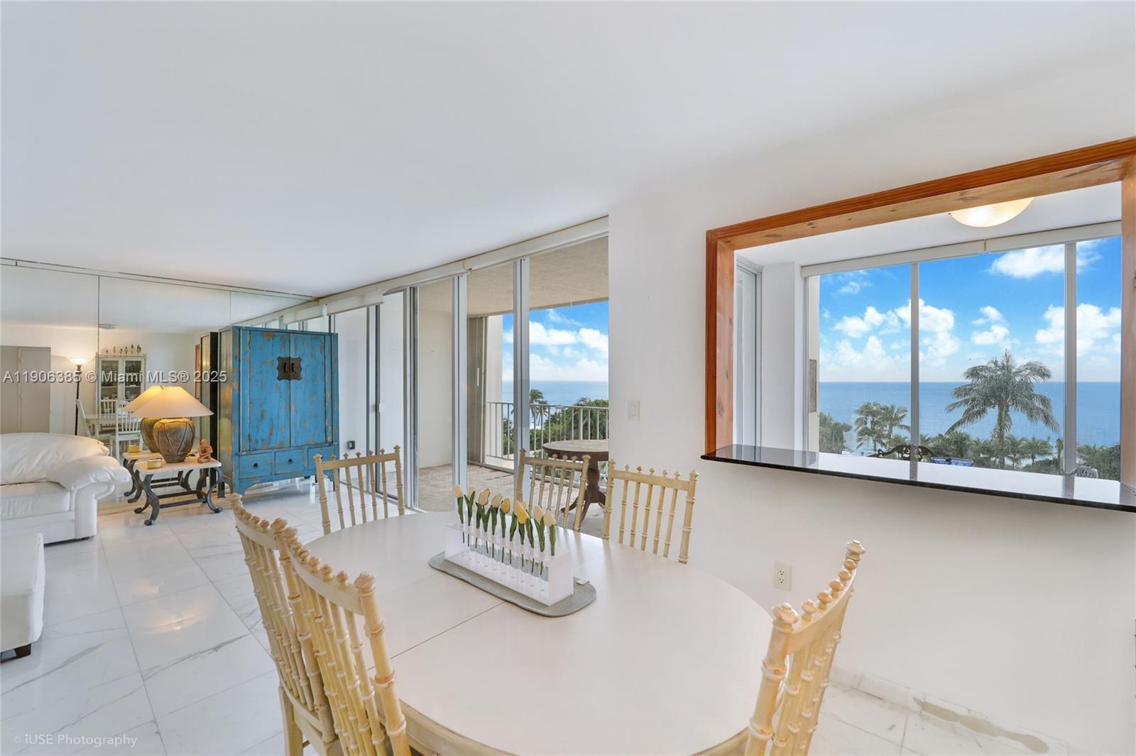 881 Ocean Drive, Unit 5D Key Biscayne, FL 33149 - Photo 5 of 18 a dining room with furniture and wooden floor