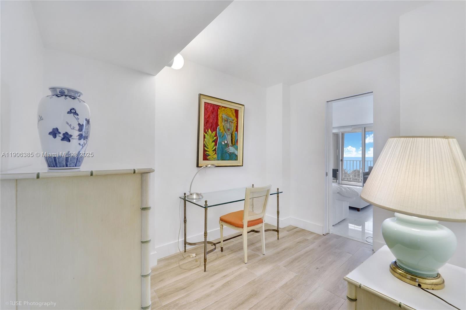 881 Ocean Drive, Unit 5D Key Biscayne, FL 33149 - Photo 9 of 18 a workspace with furniture and wooden floor