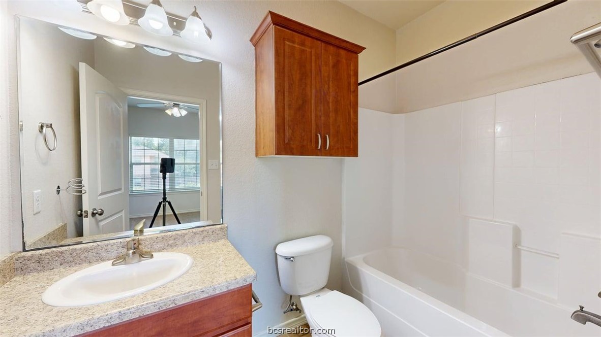 4453-4455 Reveille Road College Station, TX 77845 - Photo 32 of 37 a bathroom with a sink toilet and shower
