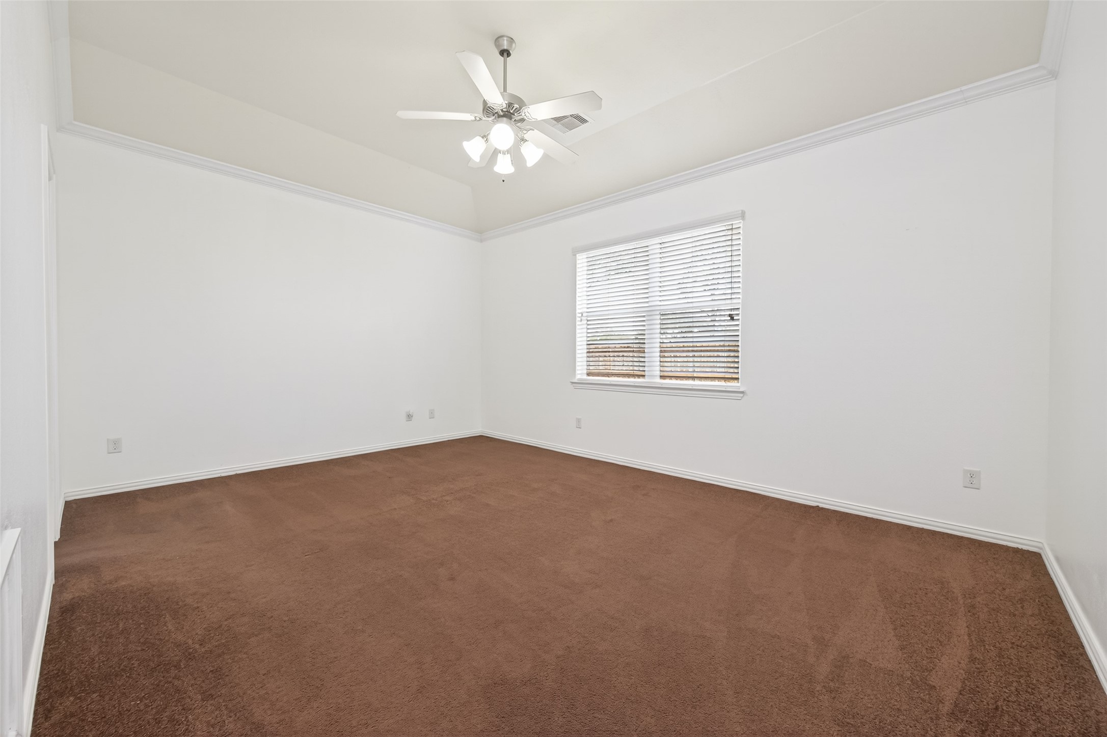 311 Volute Drive Rosharon, TX 77583 - Photo 11 of 21 an empty room with windows and chandelier fan