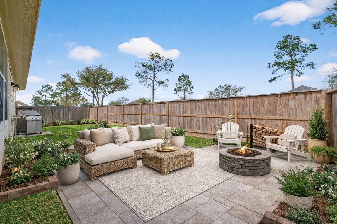 311 Volute Drive Rosharon, TX 77583 - Photo 15 of 17 a view of a patio with couches table and chairs and potted plants