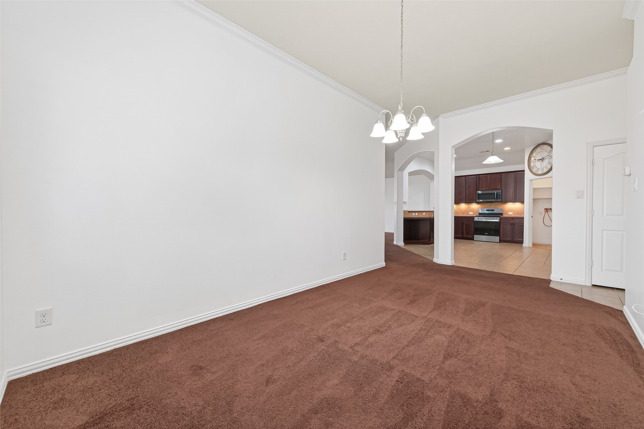 311 Volute Drive Rosharon, TX 77583 - Photo 7 of 21 a view of a livingroom with a furniture chandelier and a fireplace