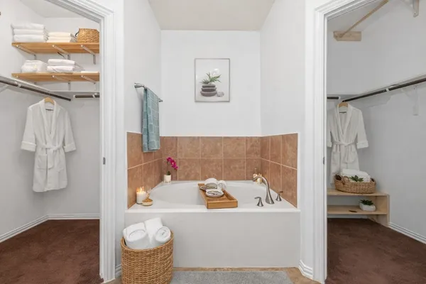 a bath tub sitting next to a bathroom