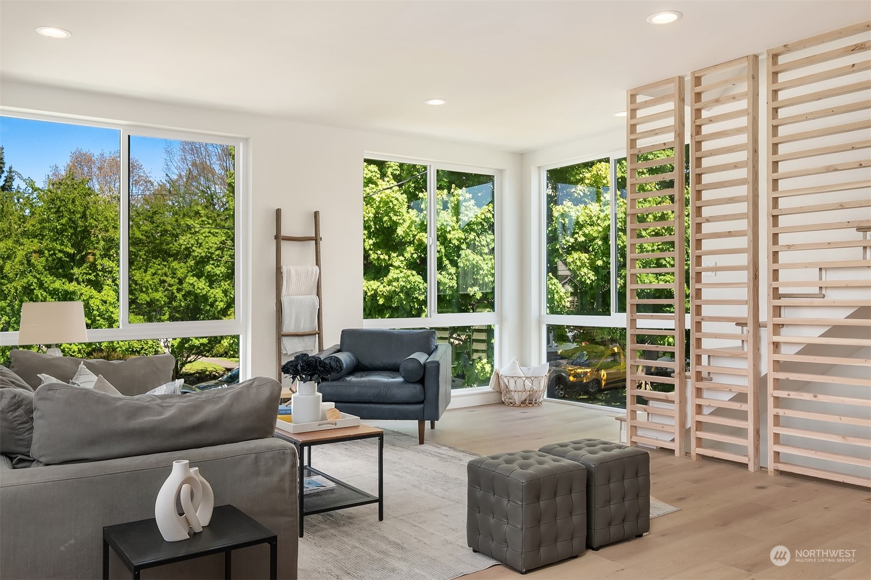 647 Northwest 54th Street, Unit A Seattle, WA 98107 - Photo 13 of 28 a living room with furniture and a large window