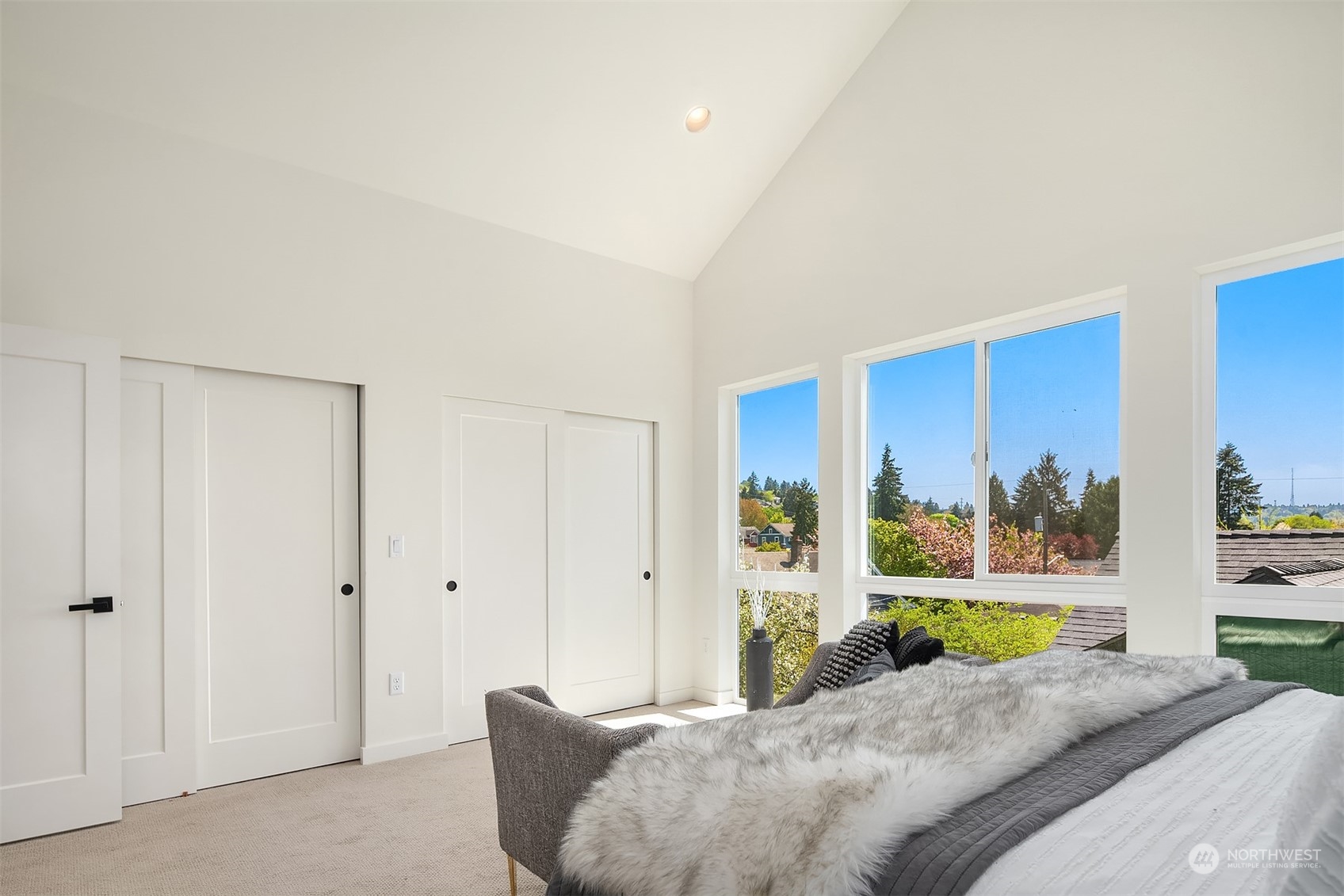647 Northwest 54th Street, Unit A Seattle, WA 98107 - Photo 22 of 28 a living room with a bed furniture and a window