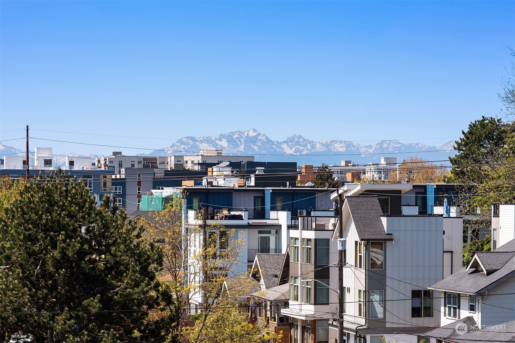 647 Northwest 54th Street, Unit A Seattle, WA 98107 - Photo 27 of 28 a view of a city that has tall buildings