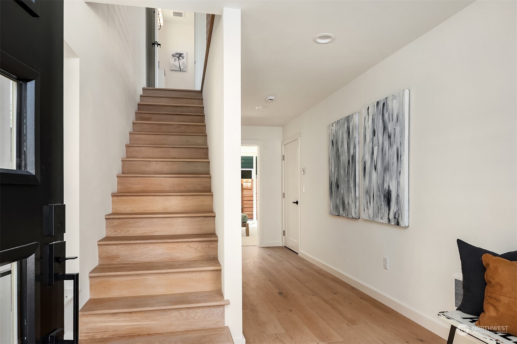 647 Northwest 54th Street, Unit A Seattle, WA 98107 - Photo 3 of 28 a view of an entryway with wooden floor