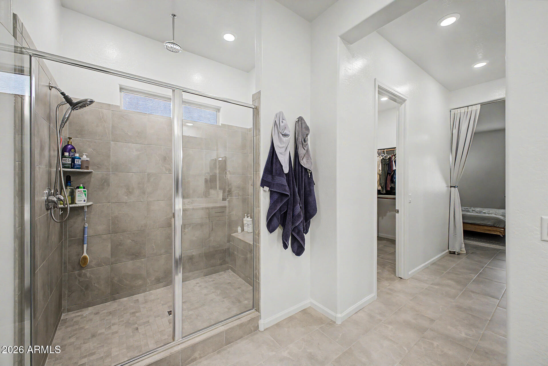 6511 West Steed Ridge Phoenix, AZ 85083 - Photo 17 of 41 a bathroom with a shower and a glass door
