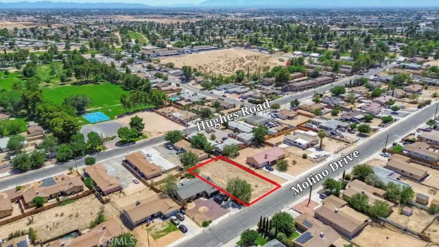 an aerial view of residential houses with outdoor space