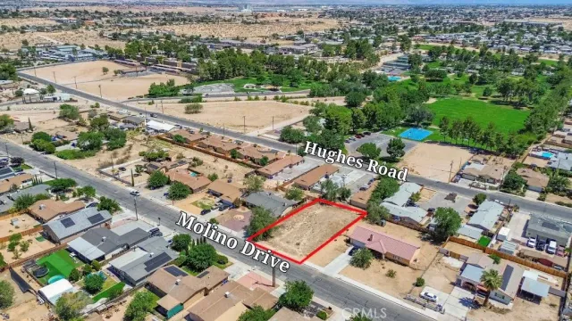 an aerial view of a city with streets and houses