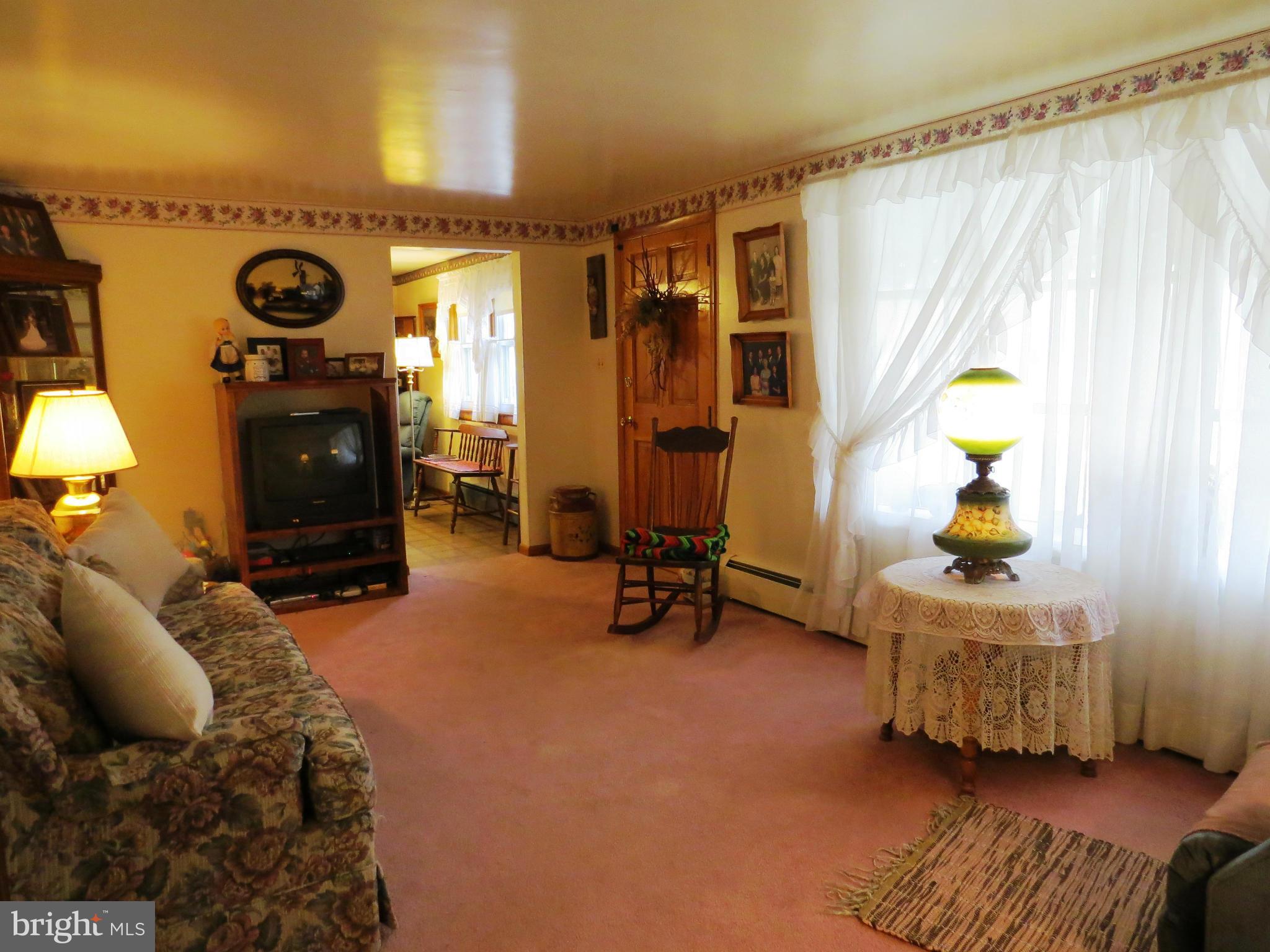 5330 St Pauls Road Manchester, MD 21102 - Photo 6 of 23 a bedroom with bed and a chandelier