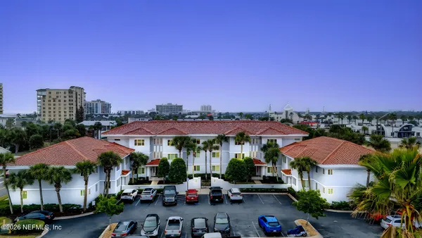 a view of a city with lots of car parked