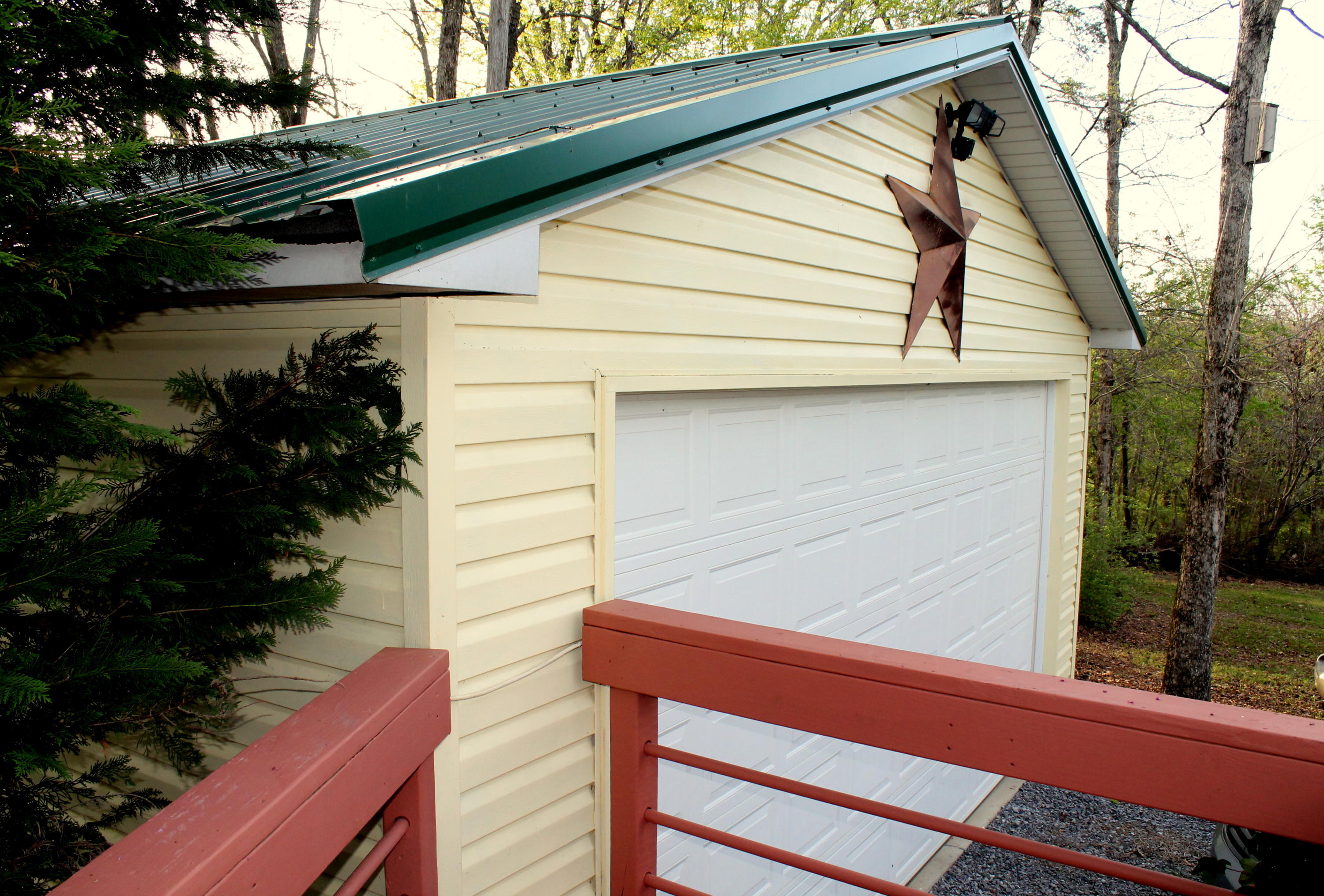 3417 Ralph Phelps Road Louisville, TN 37777 - Photo 28 of 32 This two car garage has a newer metal ro