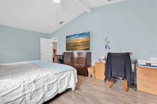 a bedroom with a bed and furniture