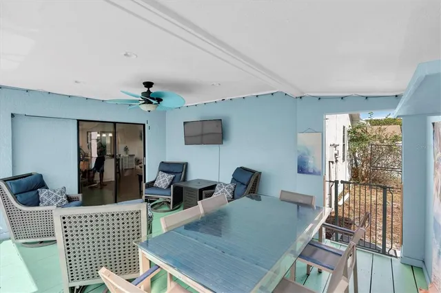 a view of a patio with swimming pool table and chairs