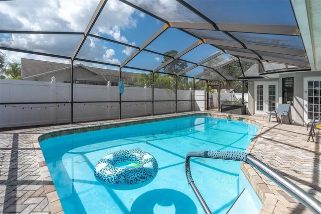 a view of a patio with table and chairs with wooden floor