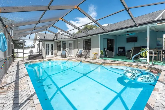 a backyard of a house with plants and trees