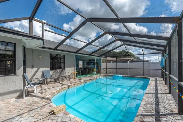 a view of a backyard with sitting area
