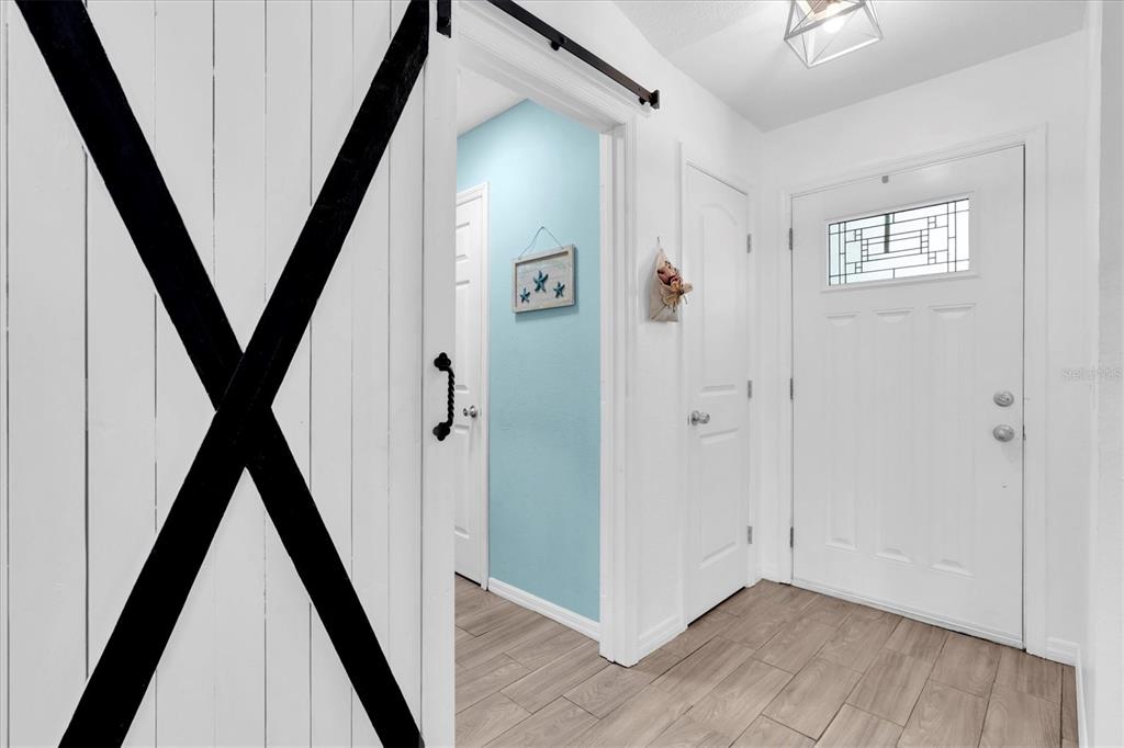 10105 Briar Circle Hudson, FL 34667 - Photo 34 of 40 a view of an entryway with hardwood