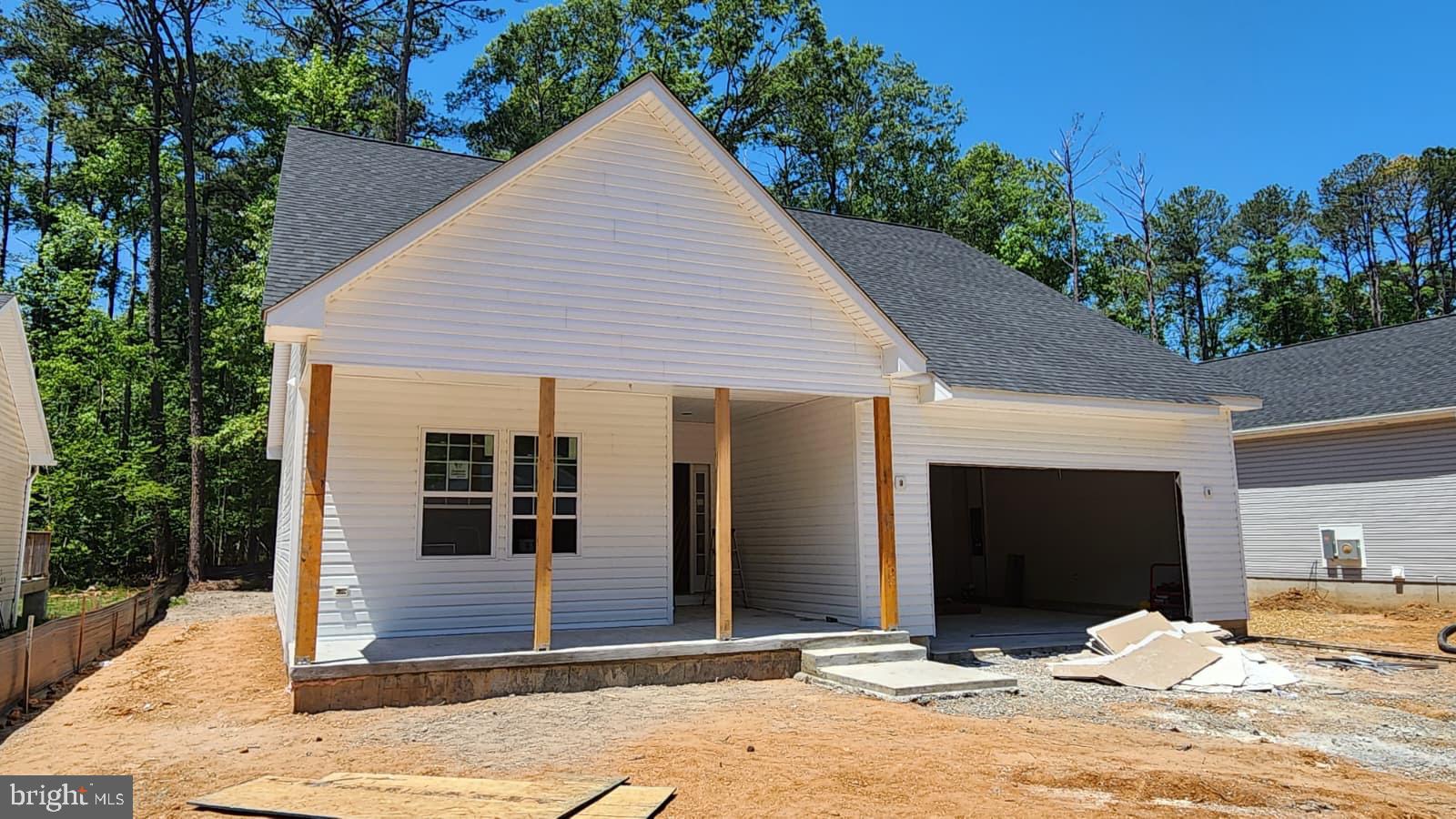171 Wildwood Road Colonial Beach, VA 22443 - Photo 2 of 4 a view of a house with a yard