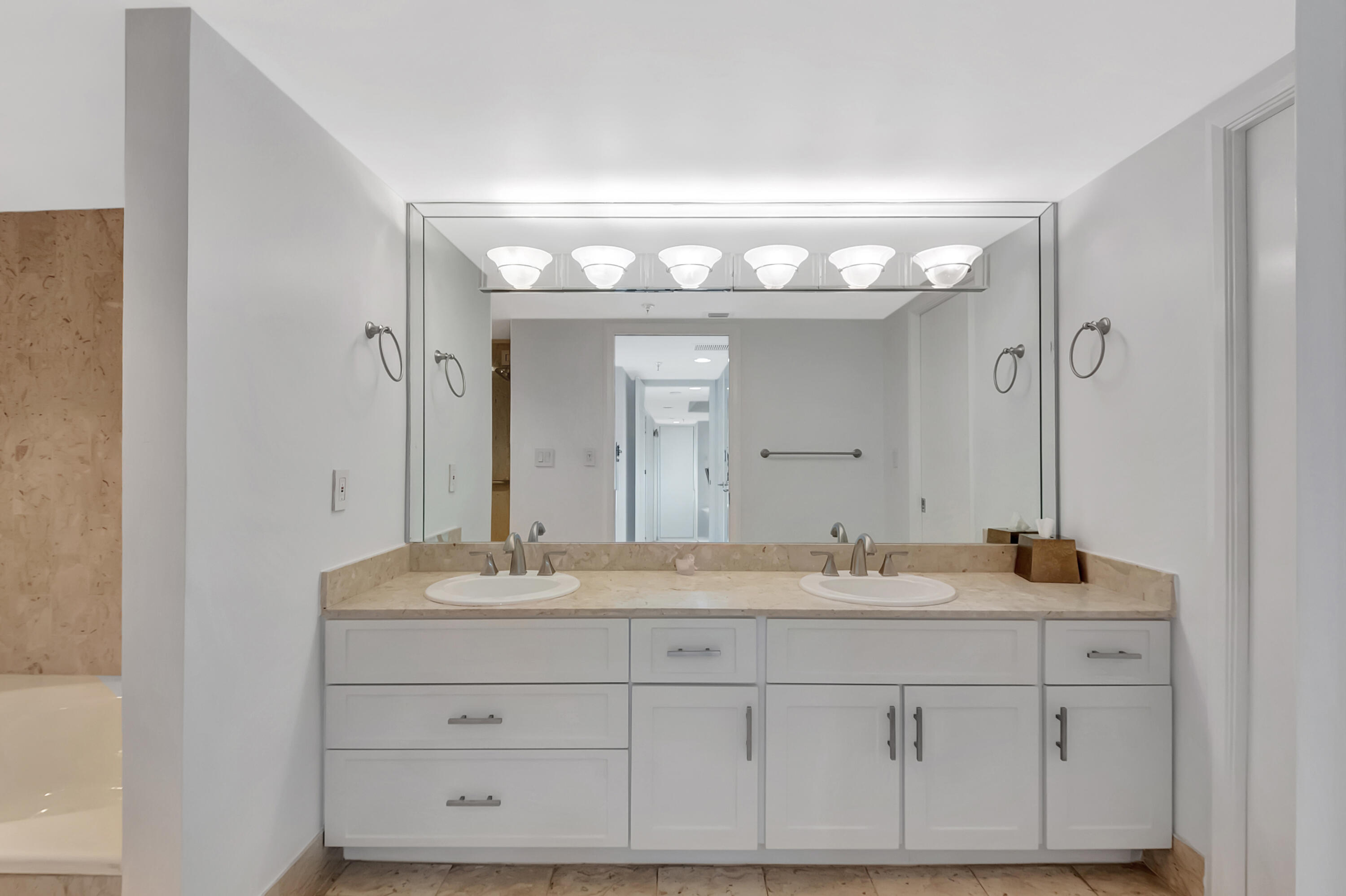 20100 Boca W Drive, Unit 126 Boca Raton, FL 33434 - Photo 21 of 58 a bathroom with a sink and a mirror