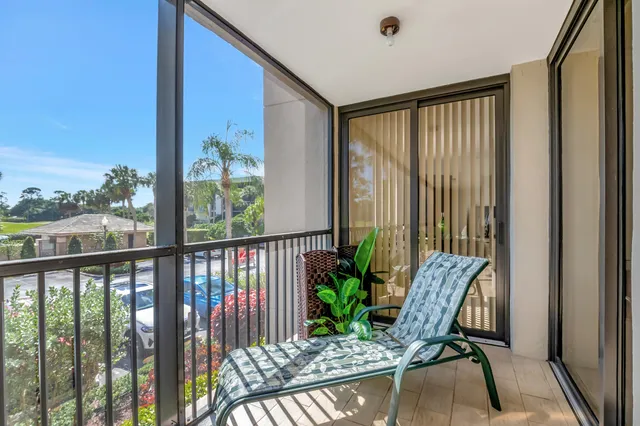 a view of a balcony with furniture