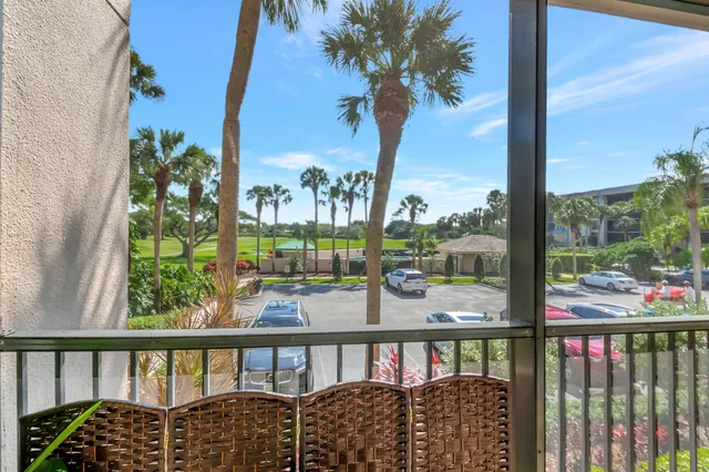 a view of kitchen cabinets with food items with white countertops