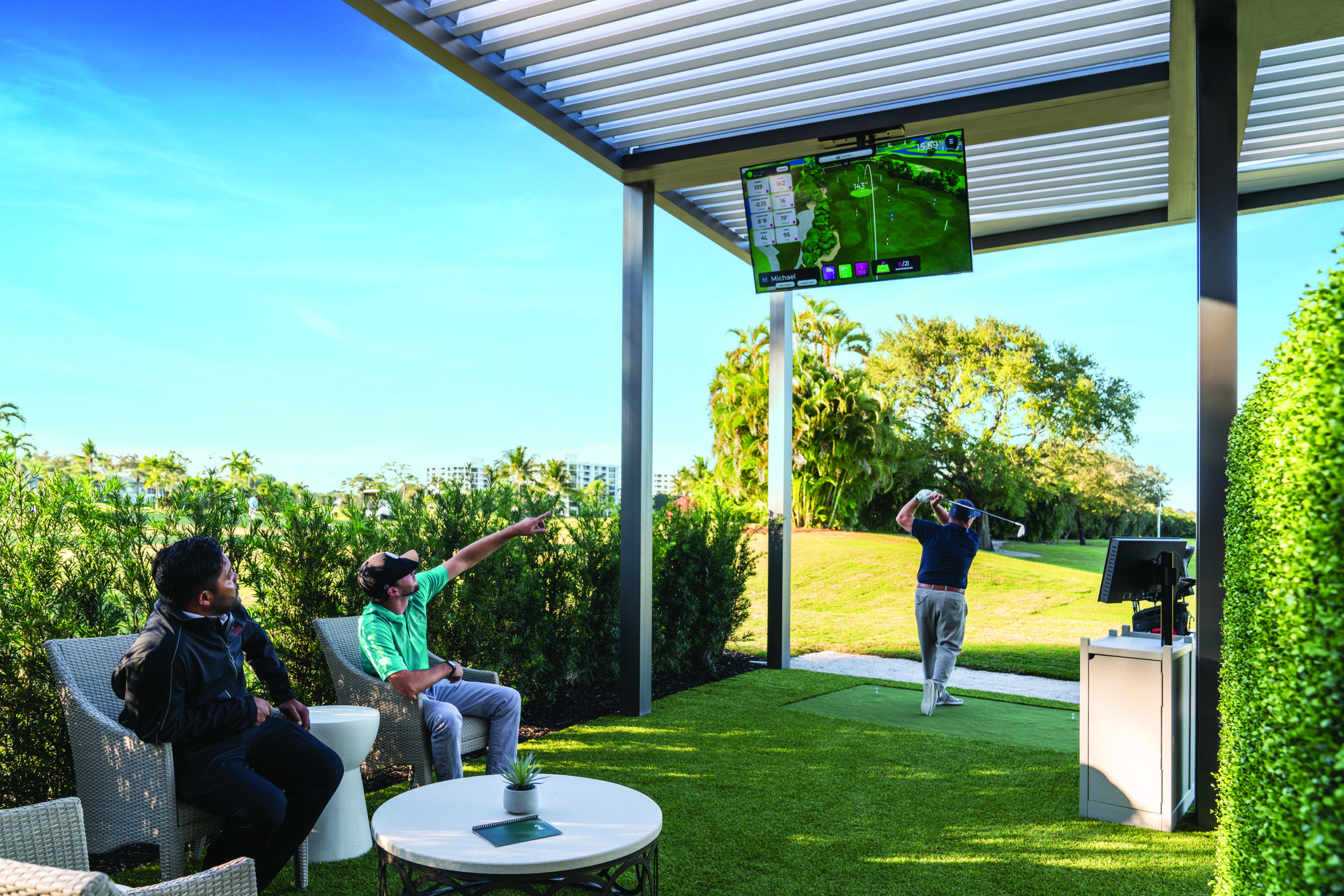 20100 Boca W Drive, Unit 126 Boca Raton, FL 33434 - Photo 48 of 58 a backyard of a house with a fountain table and chairs
