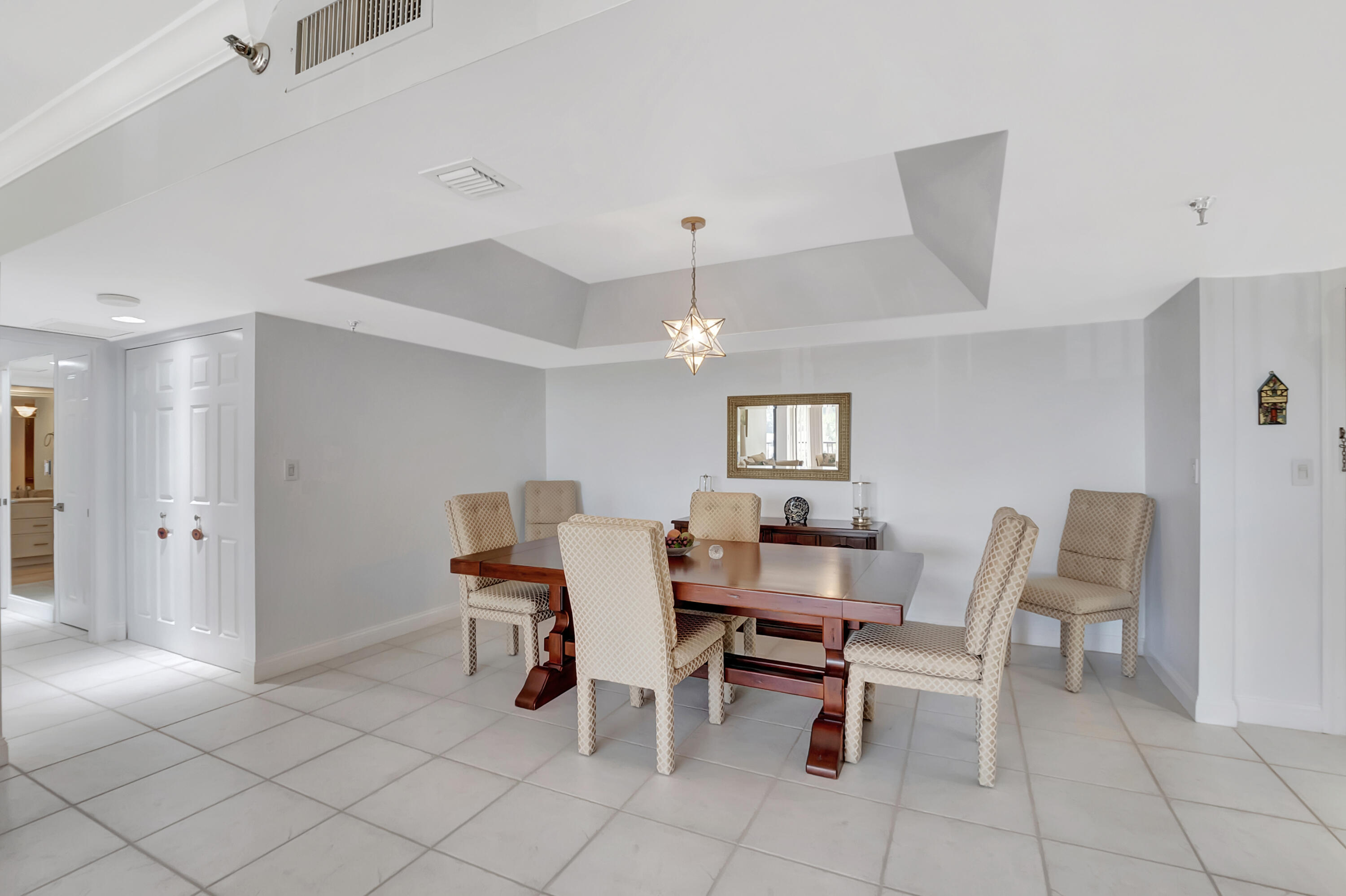 20100 Boca W Drive, Unit 126 Boca Raton, FL 33434 - Photo 7 of 58 a dining room with furniture and window