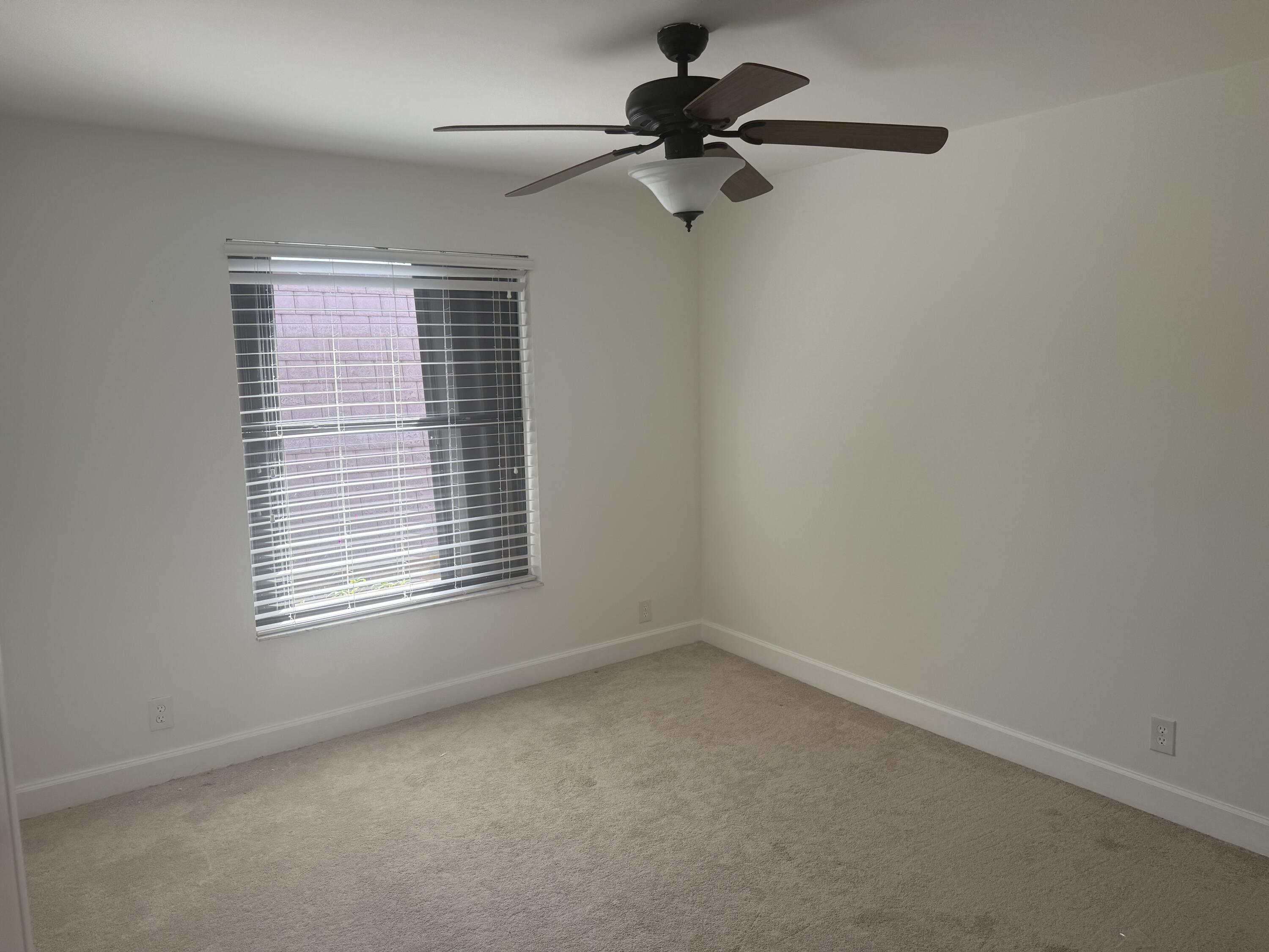 7526 Courtyard Run East Boca Raton, FL 33433 - Photo 14 of 16 a view of an empty room with a window