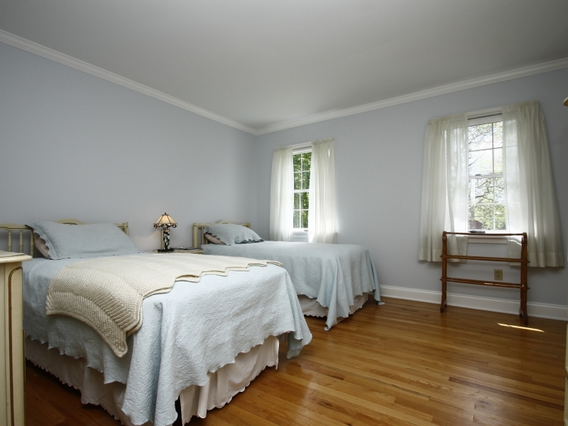 29 Middle Ridge Road New Canaan, CT 06840 - Photo 11 of 16 a bedroom with two beds and windows
