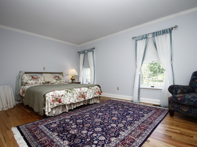 29 Middle Ridge Road New Canaan, CT 06840 - Photo 12 of 16 a bed sitting in a bedroom next to a window