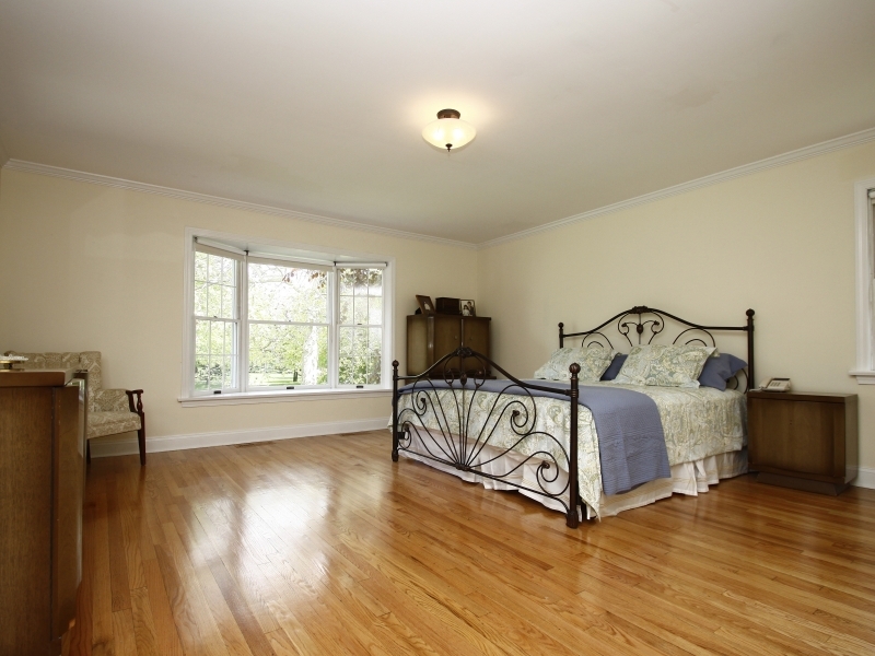29 Middle Ridge Road New Canaan, CT 06840 - Photo 10 of 16 a bedroom with a bed and wooden floor