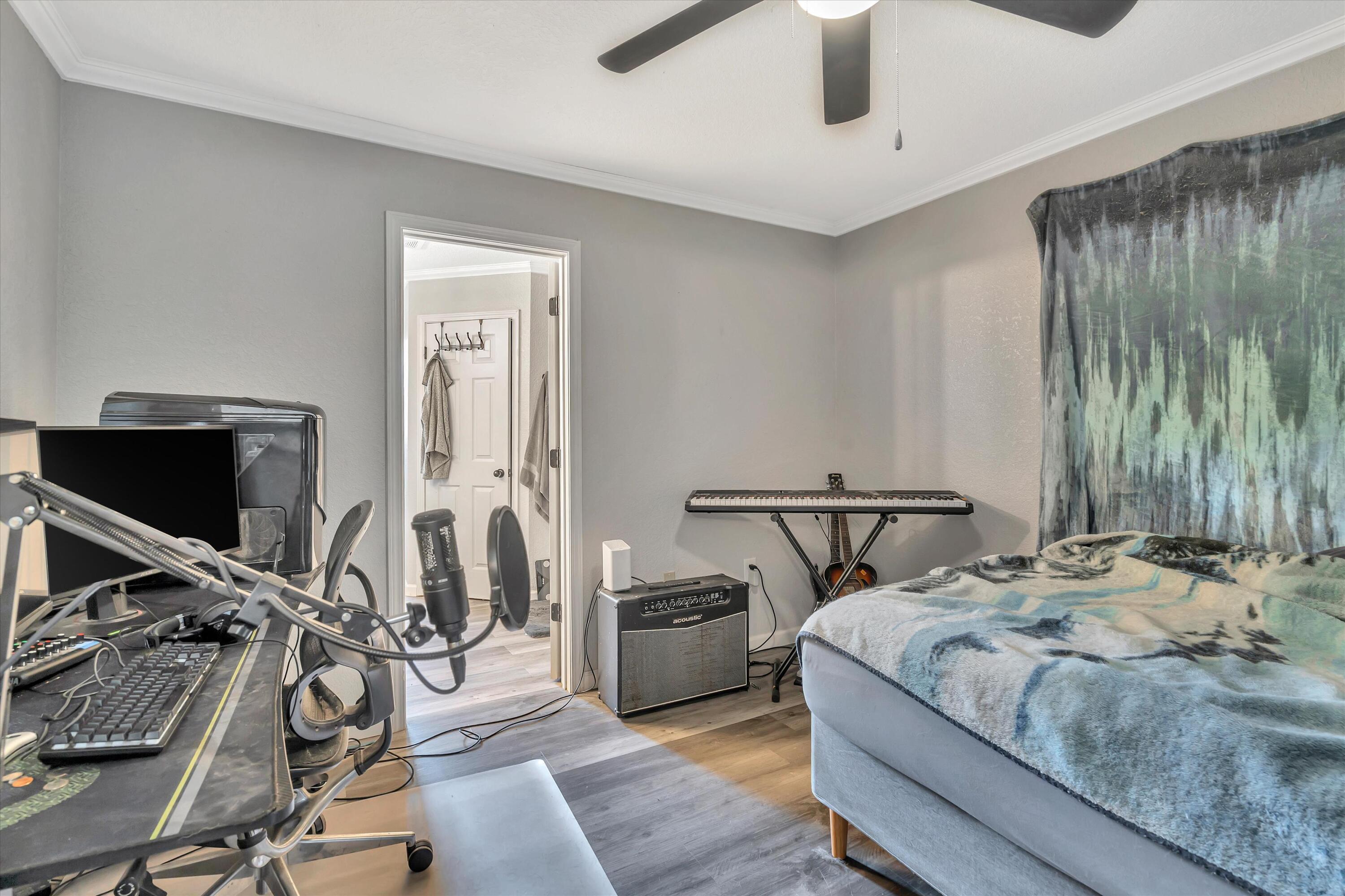 266 Limestone Circle Crestview, FL 32539 - Photo 11 of 25 a bedroom with a bed and flat screen tv