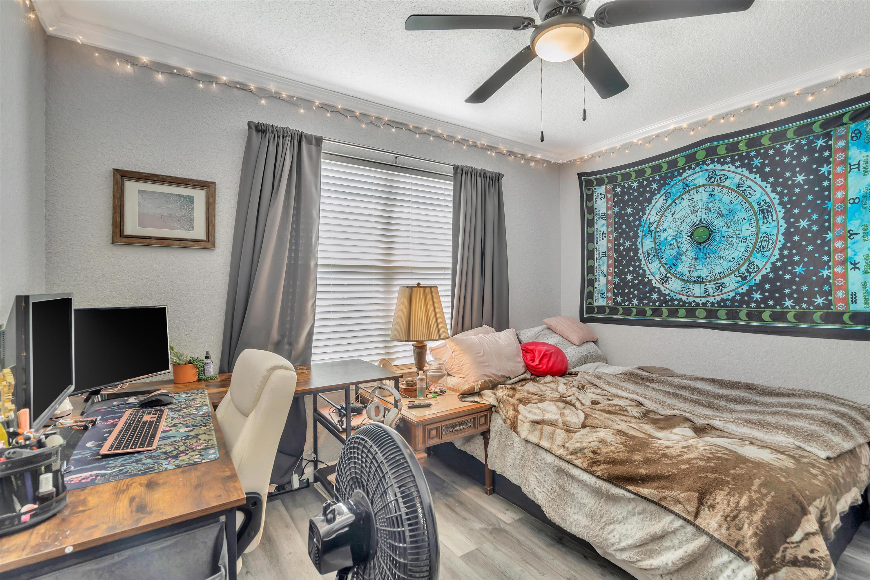 266 Limestone Circle Crestview, FL 32539 - Photo 13 of 25 a bedroom with furniture and a bed