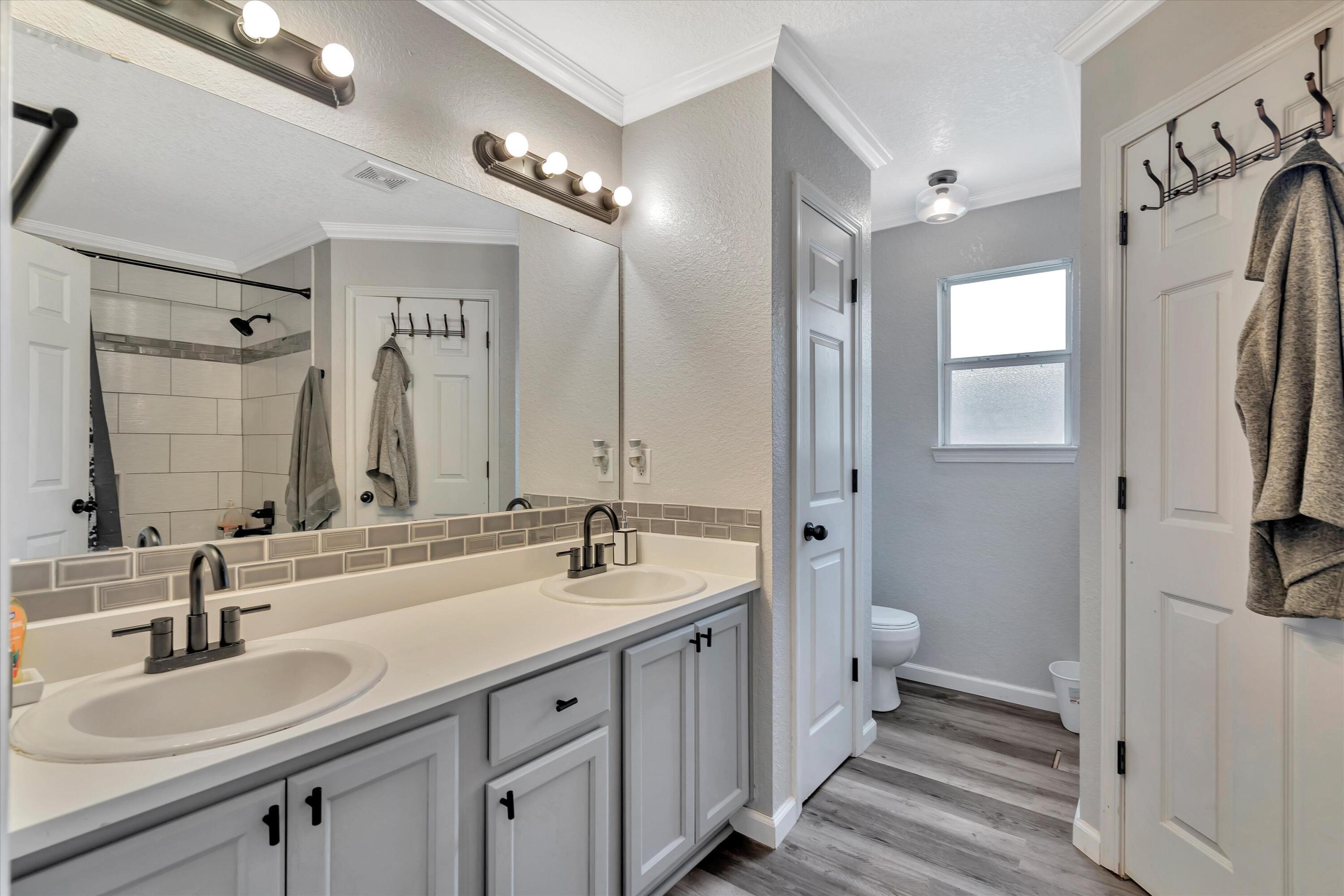 266 Limestone Circle Crestview, FL 32539 - Photo 18 of 25 a spacious bathroom with a double vanity sink double mirror and a shower