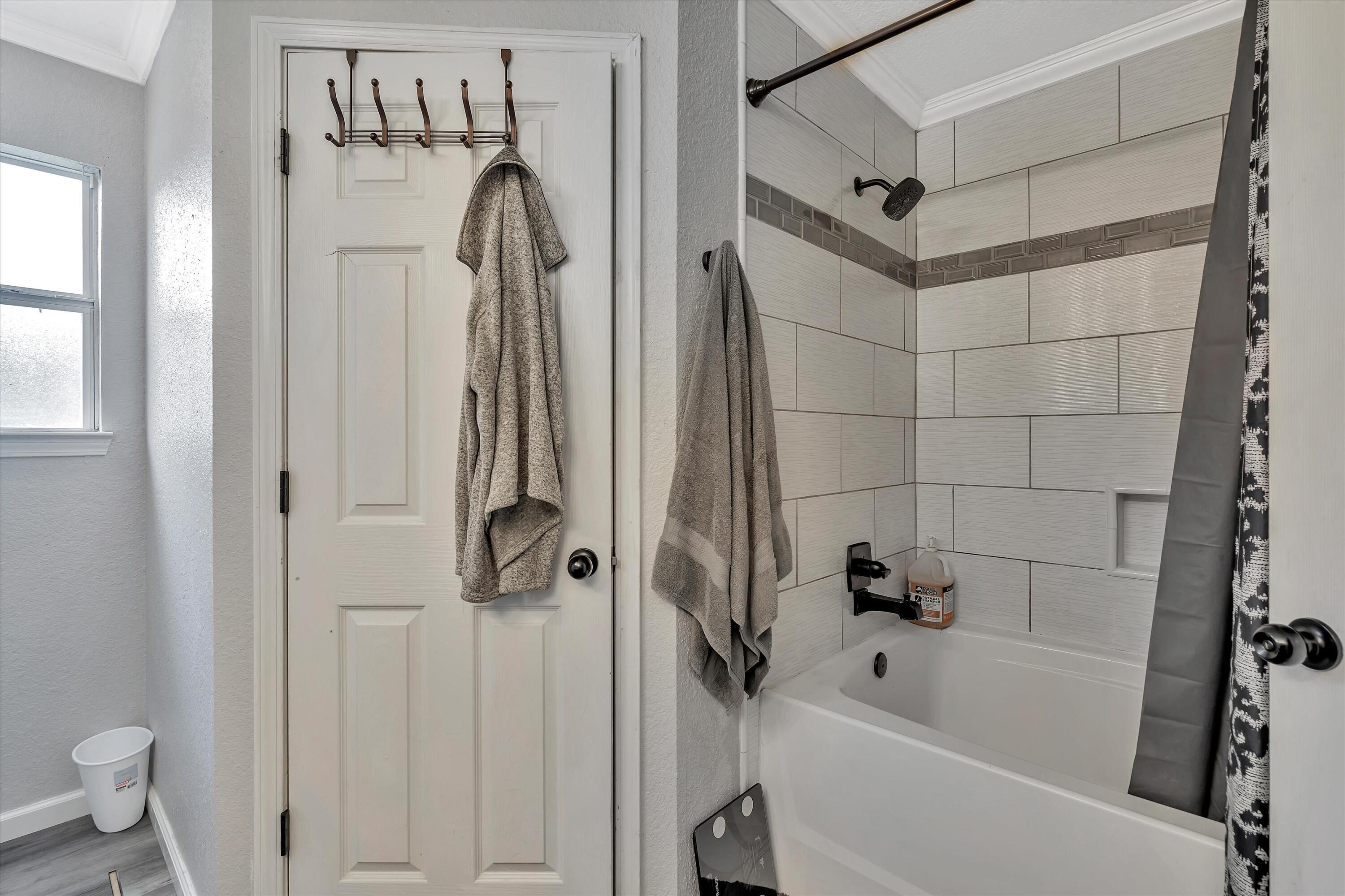 266 Limestone Circle Crestview, FL 32539 - Photo 19 of 25 a bathroom with a tub and a shower