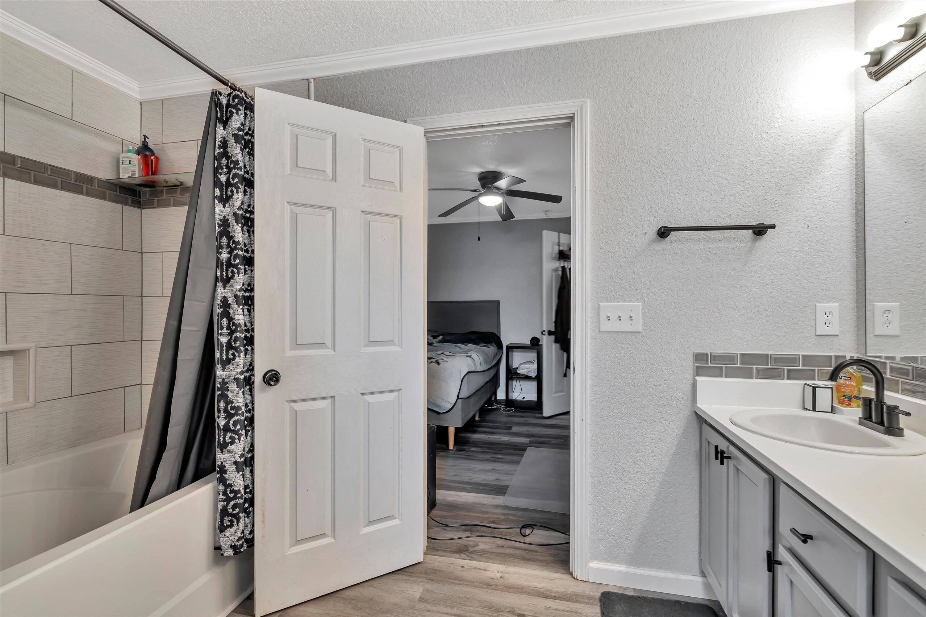 266 Limestone Circle Crestview, FL 32539 - Photo 20 of 25 a en suite bathroom with a sink and a mirror