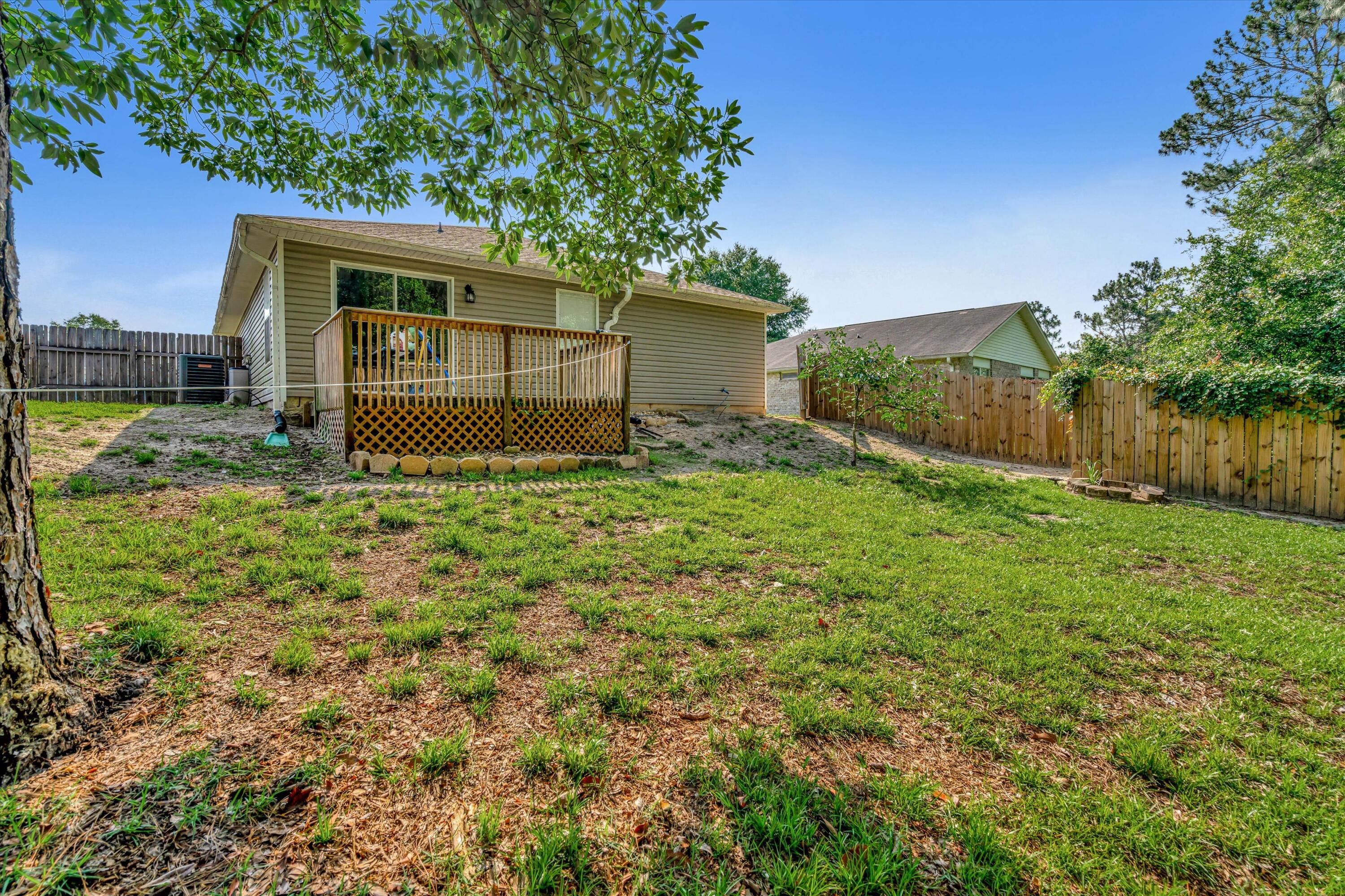 266 Limestone Circle Crestview, FL 32539 - Photo 24 of 25 a view of a house with a yard