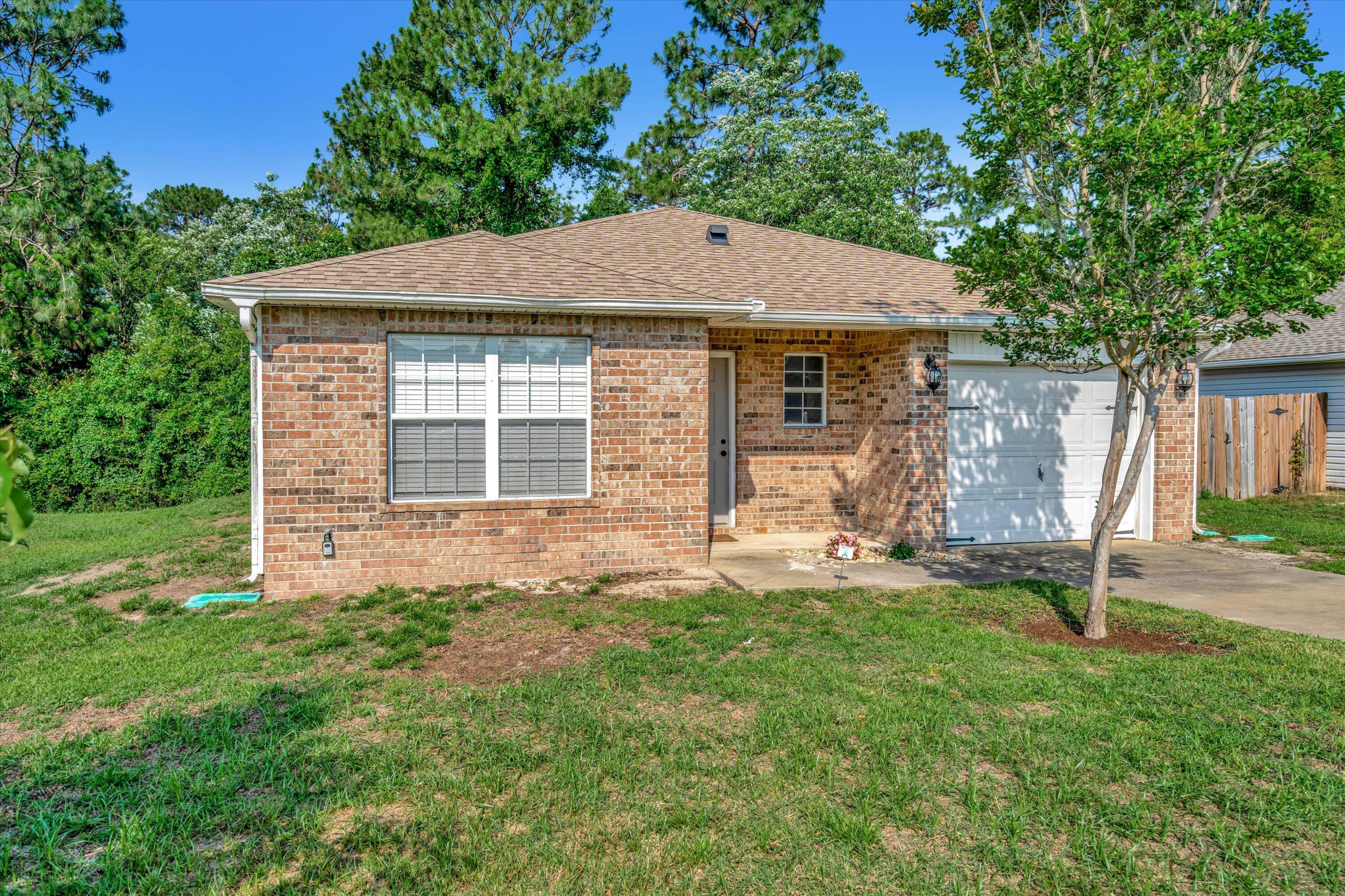 266 Limestone Circle Crestview, FL 32539 - Photo 3 of 25 a front view of a house with a yard
