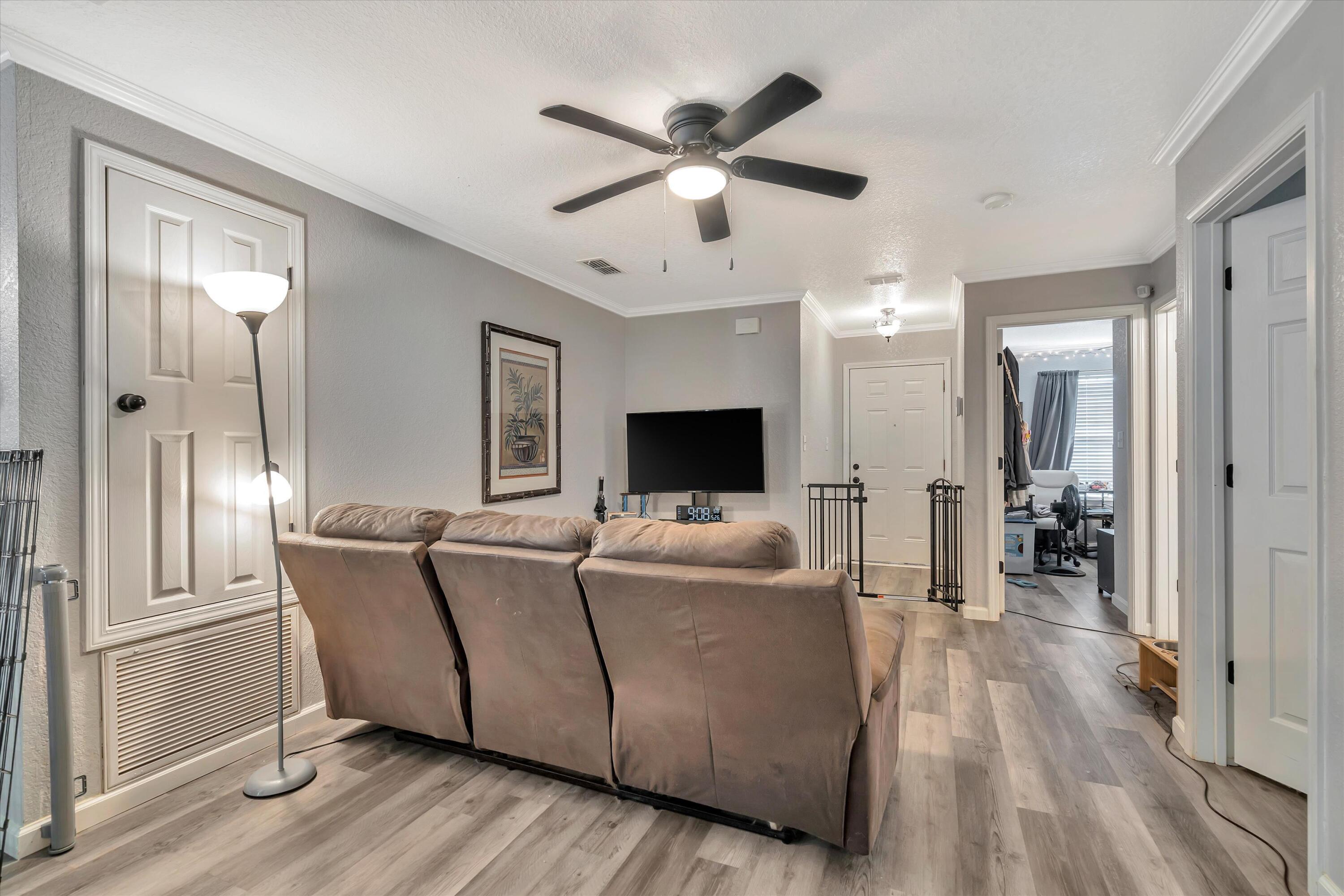 266 Limestone Circle Crestview, FL 32539 - Photo 5 of 25 a living room with furniture and a flat screen tv