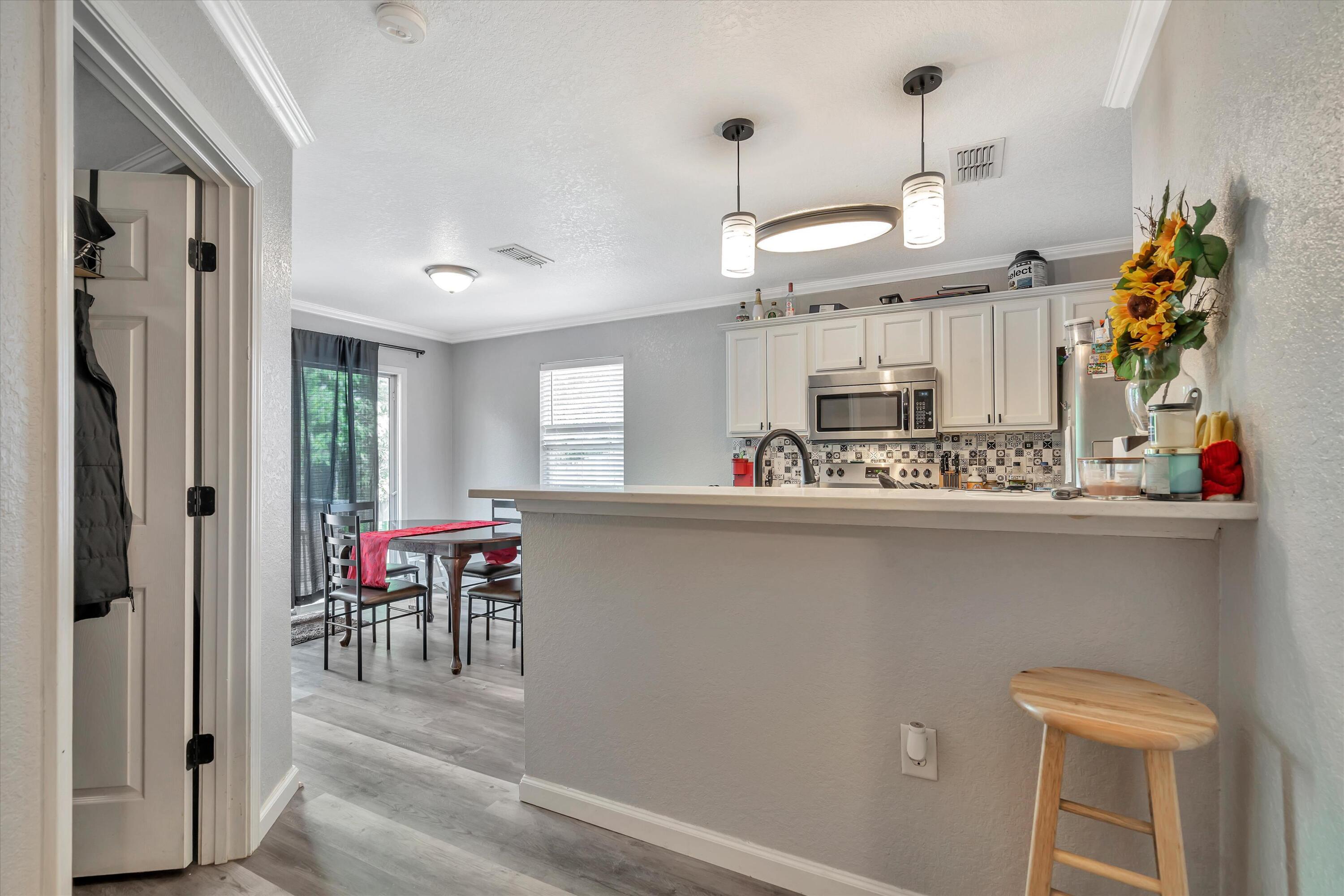 266 Limestone Circle Crestview, FL 32539 - Photo 6 of 25 a kitchen with a refrigerator and a table