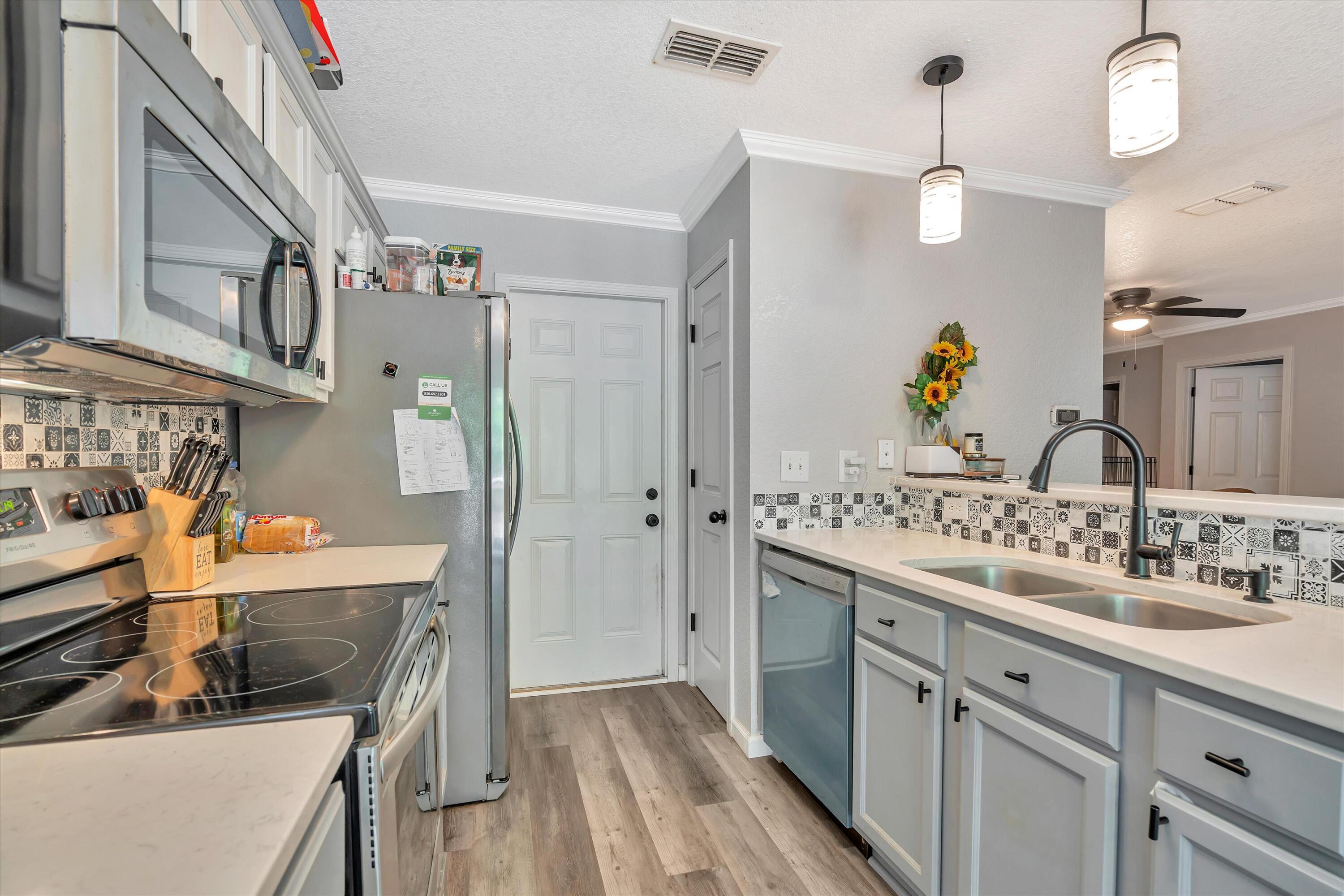 266 Limestone Circle Crestview, FL 32539 - Photo 7 of 25 a view of a kitchen and a sink