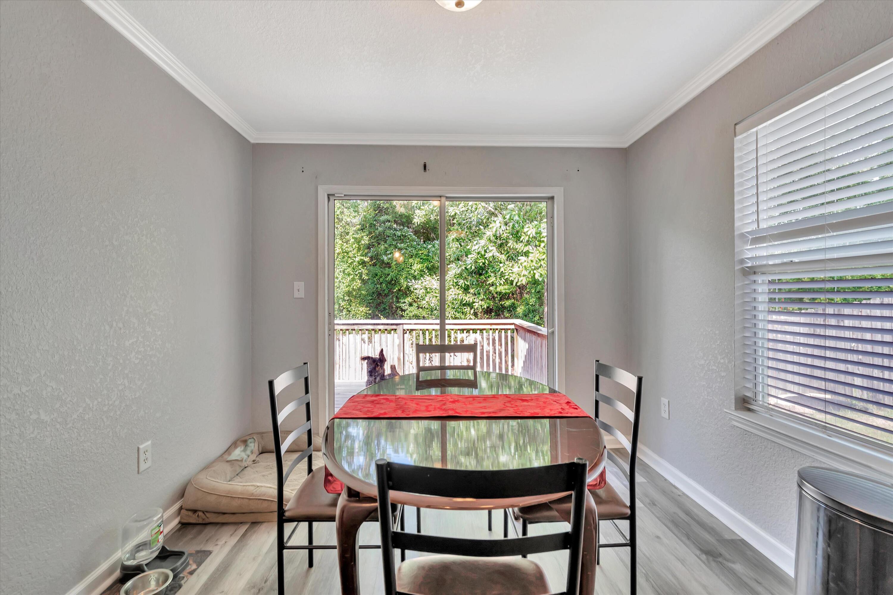 266 Limestone Circle Crestview, FL 32539 - Photo 9 of 25 a view of a dining room with furniture window and outside view