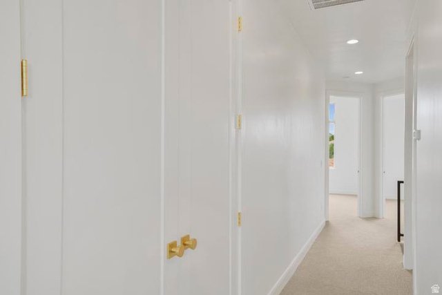 990 Manen Street Washington, UT 84780 - Photo 35 of 43 Hallway featuring neutral carpet flooring, recessed ceiling lighting, and white walls