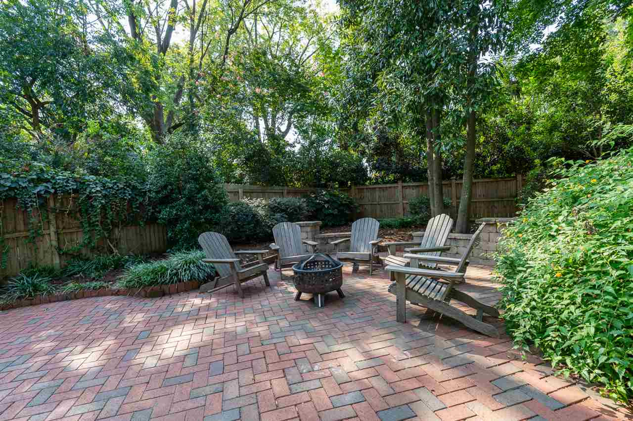 Fenced backyard with paver stone patio