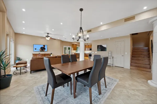 a dining room with furniture and window