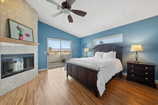 a bedroom with a bed and a fireplace