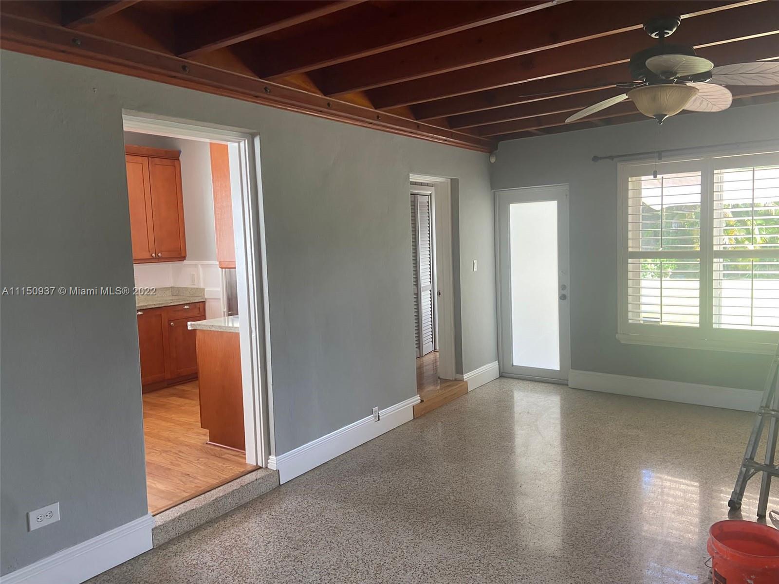 155 Southwest 28th Road Miami, FL 33129 - Photo 11 of 33 wooden floor in an empty room with a window